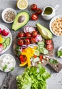 Ingredients for spring vegetable buddha bowl. Delicious healthy food. On a gray background Royalty Free Stock Photo