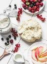 Ingredients for summer berry pie - dough, fresh ripe currant berries, raspberries, strawberries on a light background, top view Royalty Free Stock Photo