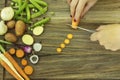 Ingredients for summer soup and woman cut carrot with knife. Royalty Free Stock Photo