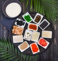 Ingredients for sushi on black plate in dark wooden background Royalty Free Stock Photo