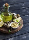 Ingredients to prepare homemade mayonnaise - olive oil, quail eggs, lemon, mustard. Royalty Free Stock Photo