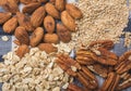 Ingredients to prepare smoothie of banana and seeds, walnut, oatmeal, almond, sesame, a healthy breakfast 2 Royalty Free Stock Photo