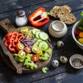 Ingredients to prepare vegetable salad - tomatoes, cucumber, celery, bell pepper, red onion, quail eggs, garden herbs and spices o Royalty Free Stock Photo