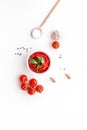 Ingredients for tomato sauce. Cherry tomatoes, garlic, green basil, black pepper, salt in spoon on white background top Royalty Free Stock Photo