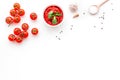 Ingredients for tomato sauce. Cherry tomatoes, garlic, green basil, black pepper, salt in spoon on white background top Royalty Free Stock Photo