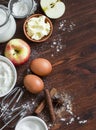 Ingredients and tools for baking - flour, eggs, butter, apples, cinnamon Royalty Free Stock Photo