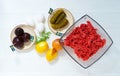 Ingredients for a traditional Swedish dish beef Lindstrom. Freshly minced beef, boiled potato, white chopped onion, pickles, pickl Royalty Free Stock Photo