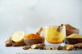 Ingredients for turmeric hot tea on grey background. Healthy ayurvedic drink with lemon, ginger, cinnamon, turmeric. Immune Royalty Free Stock Photo