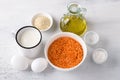 Ingredients for vegetarian dish, lentil bread, pancakes, casseroles: red lentils, yogurt, olive oil, eggs, sesame seeds, baking Royalty Free Stock Photo