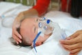 Inhalation baby boy age about 1 years old on patient bed. Respiratory Syncytial Virus RSV. Intensive care on bed at hospital
