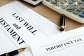 Inheritance tax and last will and testament on a desk. Royalty Free Stock Photo