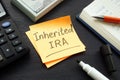 Inherited IRA memo on the color paper and calculator. Royalty Free Stock Photo