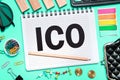 initial coin offering. ICO with office tools on blue background. Concept of the choice ICO Royalty Free Stock Photo