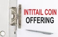 INITIAL COIN OFFERING text on the paper folder with pen. Business concept Royalty Free Stock Photo