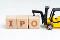 Initial Public Offerings, company going public in stock market, cube wooden block with alphabets combine the word IPO with Royalty Free Stock Photo