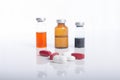 Injection ampule with pills show medicine concept Royalty Free Stock Photo
