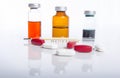 Injection ampule with pills show medicine concept Royalty Free Stock Photo