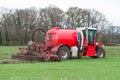 Injection of liquid manure with arable manure spreader Royalty Free Stock Photo