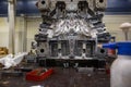 Injection mold under maintenance with huge arrenge of maintenance equipment, industrial concept