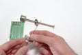 Injection needle`s manual setting on reusable medical syringe