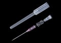 Injection needle with syringe casing isolated on black background Royalty Free Stock Photo