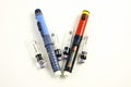 Injection pens and cartridge on a white background. Royalty Free Stock Photo
