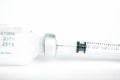 Injection preparation with ampoule and syringe on white