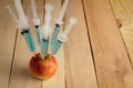 Injection into red apple Royalty Free Stock Photo