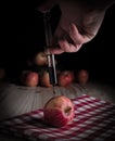 Injection of toxin into an organic apple Royalty Free Stock Photo