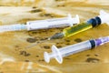 Injectors with medical preparations. Narcotic with AIDS on table