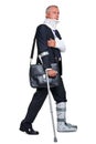 Injred businessman on crutches on white Royalty Free Stock Photo