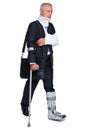Injred businessman on crutches on white Royalty Free Stock Photo