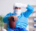 Injured american football player recovering in hospital Royalty Free Stock Photo