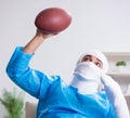 Injured american football player recovering in hospital Royalty Free Stock Photo