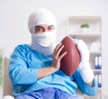 Injured american football player recovering in hospital Royalty Free Stock Photo