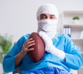 Injured american football player recovering in hospital Royalty Free Stock Photo