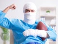 Injured american football player recovering in hospital Royalty Free Stock Photo