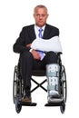 Injured businessman in a wheelchair isolated Royalty Free Stock Photo