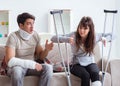 Injured family of wife and husband recovering at home Royalty Free Stock Photo