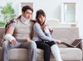 Injured family of wife and husband recovering at home Royalty Free Stock Photo