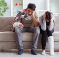 Injured family of wife and husband recovering at home Royalty Free Stock Photo