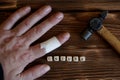 The injured hand of the joiner. Hammer on the finger. Injury in carpentry work Royalty Free Stock Photo