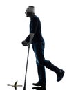 Injured man careless walking with crutches silhouette Royalty Free Stock Photo