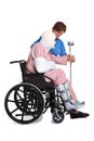 Injured man in wheelchair with nurse