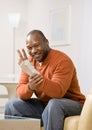 Injured man with wrist splint gesturing Royalty Free Stock Photo