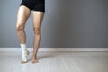 Injured painful foot with white elastic bandage Royalty Free Stock Photo