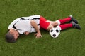 Injured soccer player lying on grass