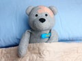 Injured Teddy Bear plasters head bed thermometer flu
