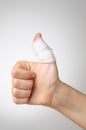 Injured thumb with bandage