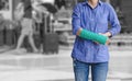 Injured woman with green cast on hand and arm on traveler in mot Royalty Free Stock Photo